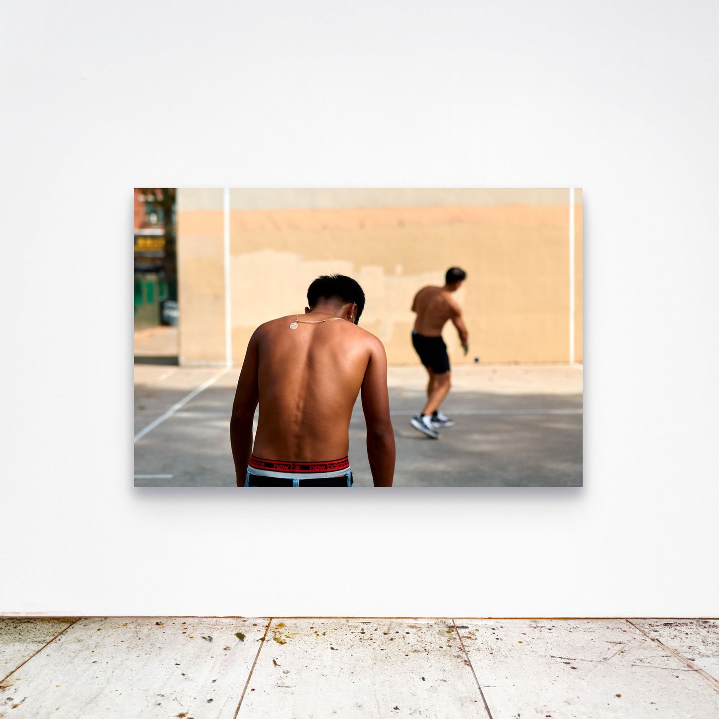 Chloe Albert's fine art print '18 Carat' shown unframed at 60 by 40 inches on a gallery wall above a concrete floor, displaying the large statement size in a room.