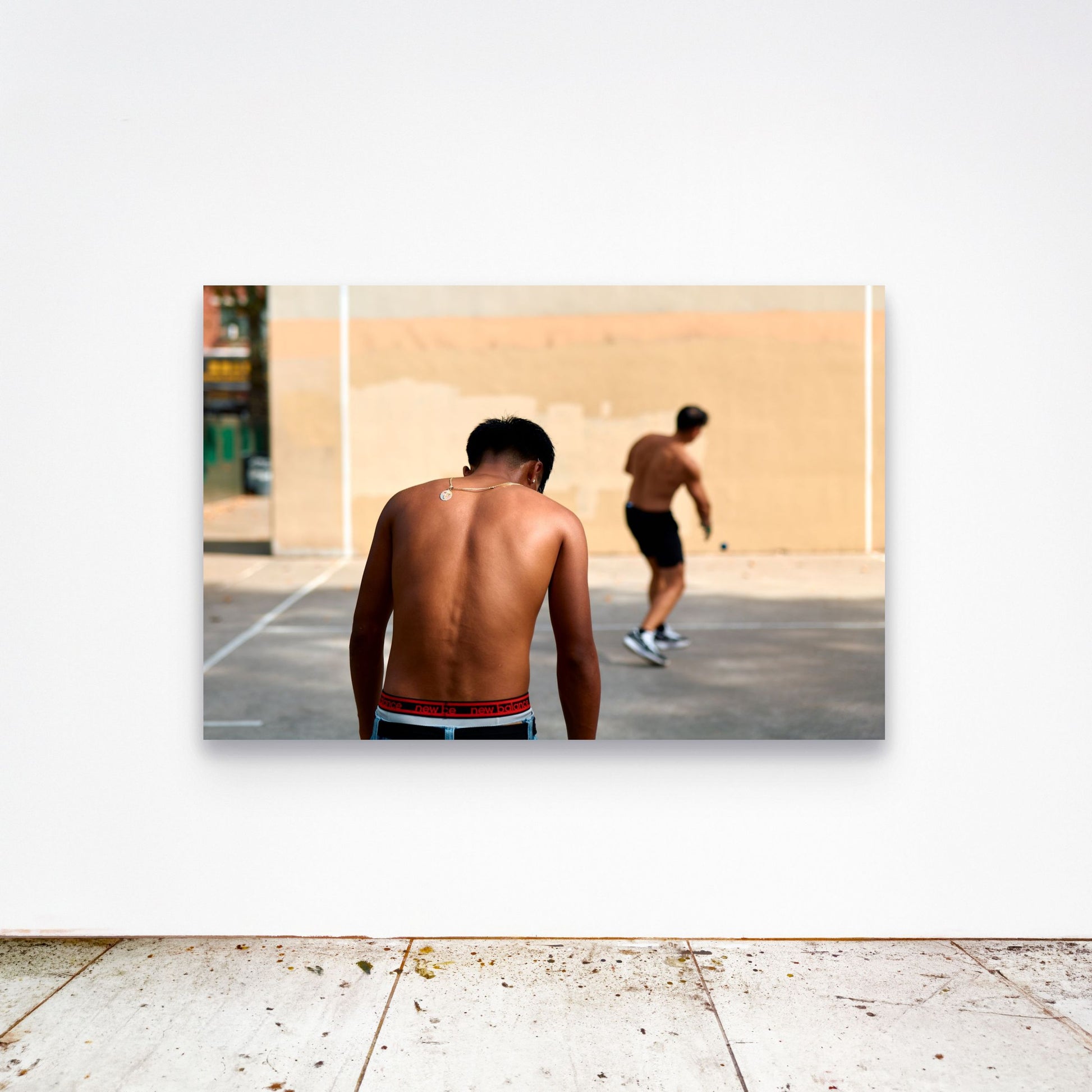 Chloe Albert's fine art print '18 Carat' shown unframed at 60 by 40 inches on a gallery wall above a concrete floor, displaying the large statement size in a room.
