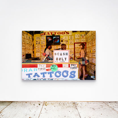 Chloe Albert's fine art print 'Cash Only' shown unframed at 60 by 40 inches on a gallery wall above a concrete floor, displaying the large statement size in a room.