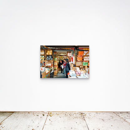 Chloe Albert's fine art print 'Chinatown' shown unframed at 36 by 24 inches on a gallery wall, displaying the print at scale in a room setting.
