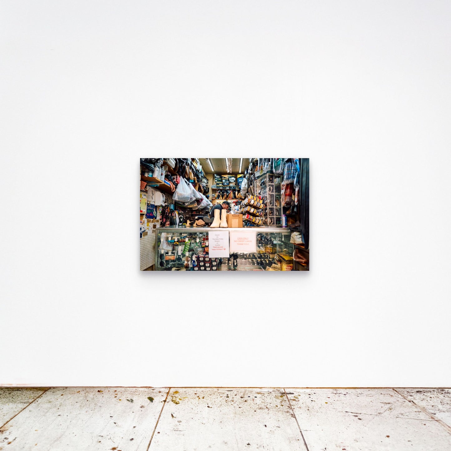 Chloe Albert's fine art print 'Cobbler' shown unframed at 36 by 24 inches on a gallery wall, displaying the print at scale in a room setting.