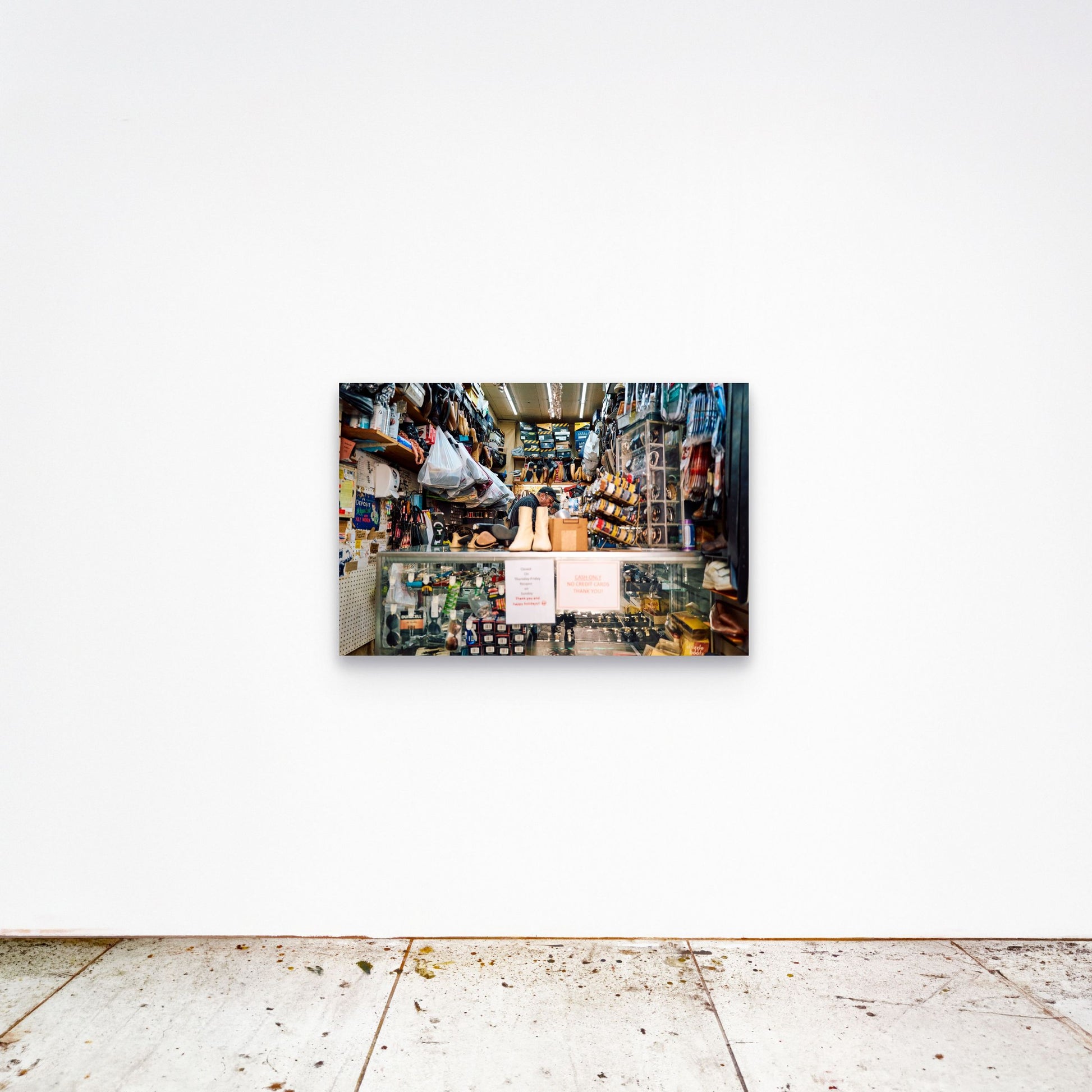 Chloe Albert's fine art print 'Cobbler' shown unframed at 36 by 24 inches on a gallery wall, displaying the print at scale in a room setting.