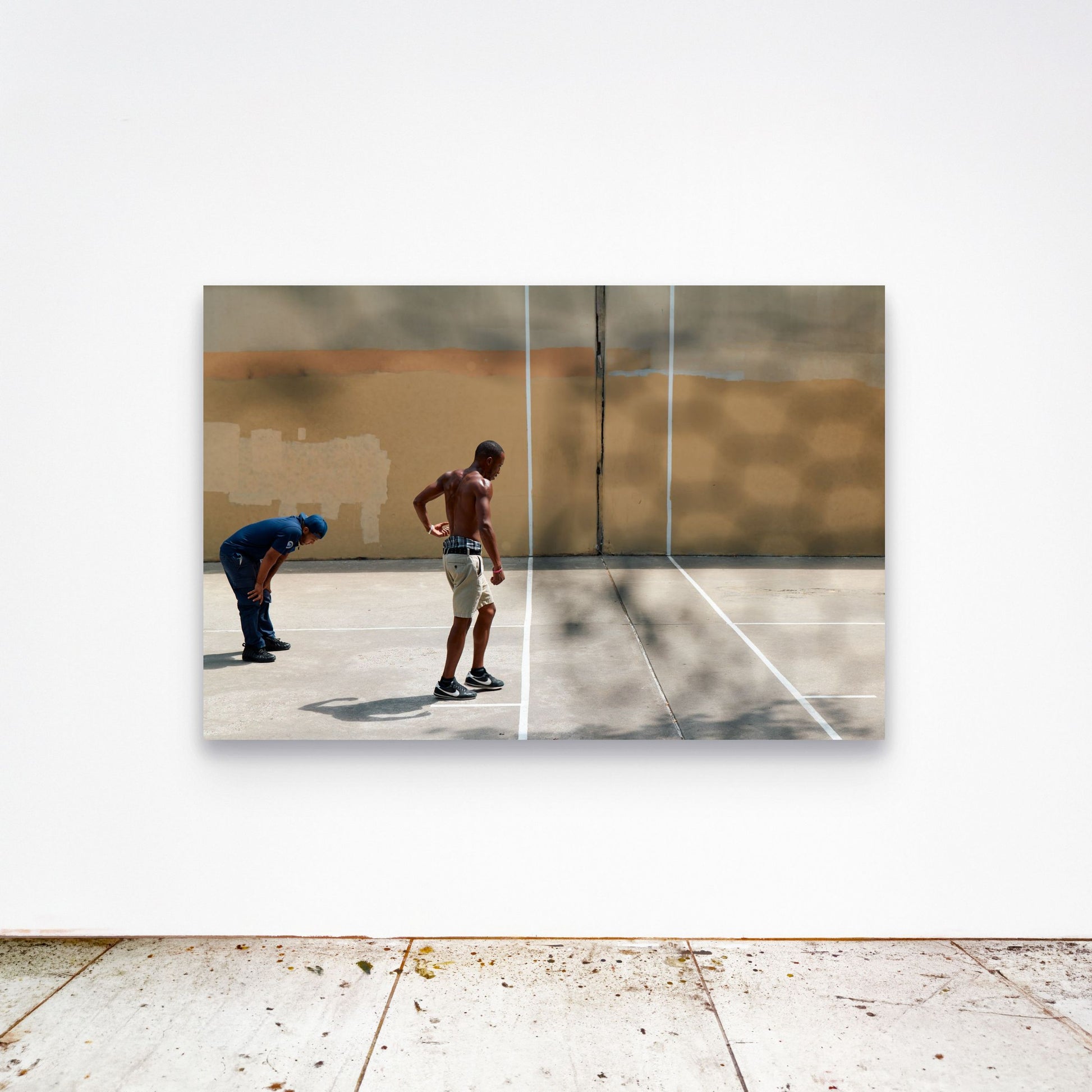Chloe Albert's fine art print 'Concrete Womb' shown unframed at 60 by 40 inches on a gallery wall above a concrete floor, displaying the large statement size in a room.