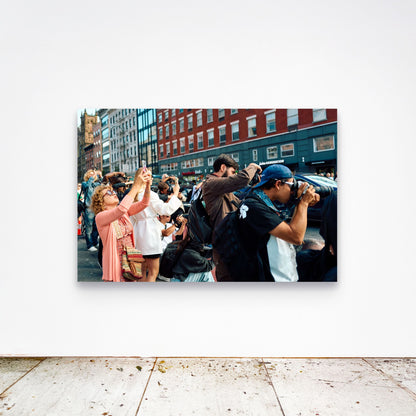 Chloe Albert's fine art print 'Crowd' shown unframed at 60 by 40 inches on a gallery wall above a concrete floor, displaying the large statement size in a room.