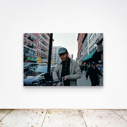 Chloe Albert's fine art print 'Delivery Driver' shown unframed at 60 by 40 inches on a gallery wall above a concrete floor, displaying the large statement size in a room.