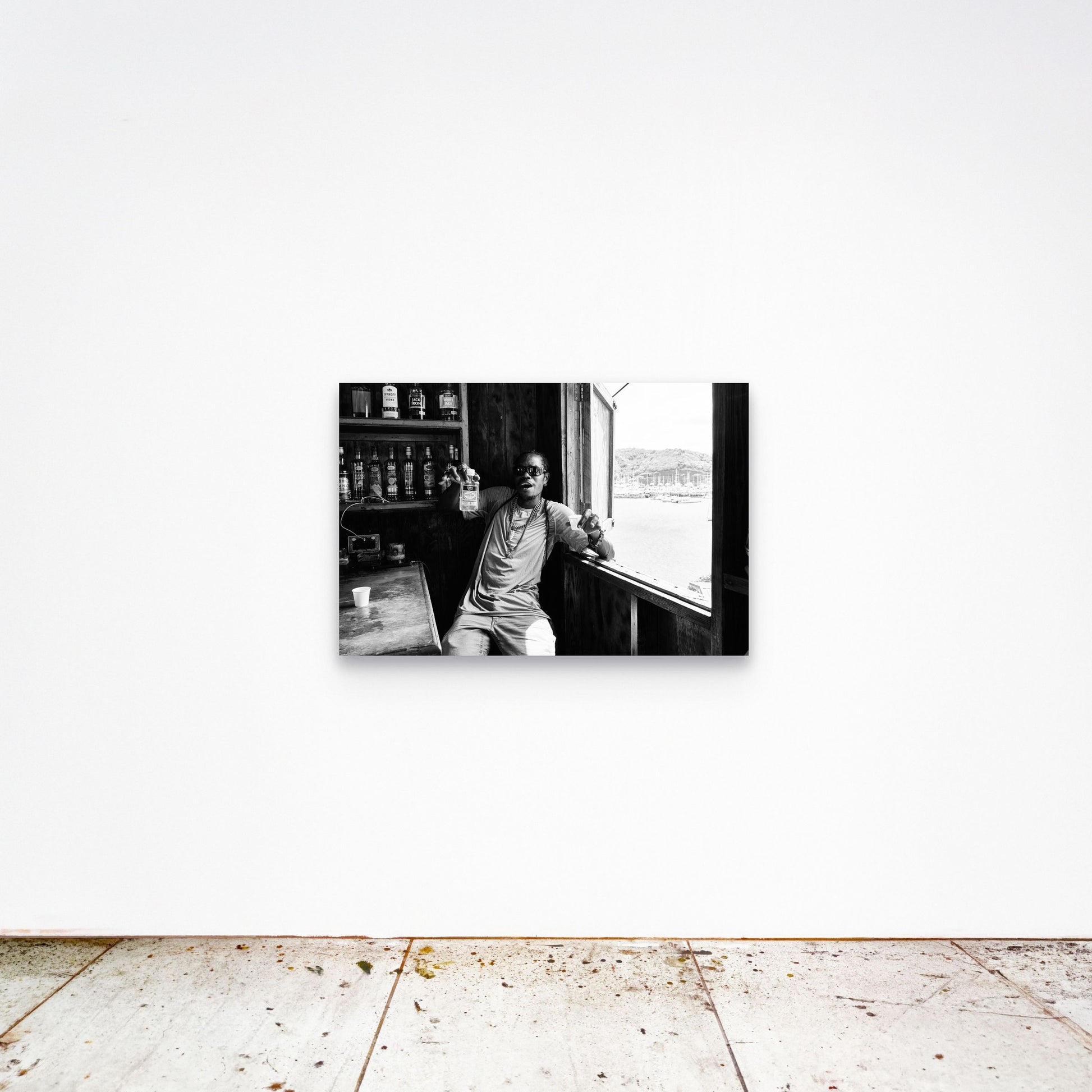 Chloe Albert's fine art print 'Dive Bar' shown unframed at 36 by 24 inches on a gallery wall, displaying the print at scale in a room setting.