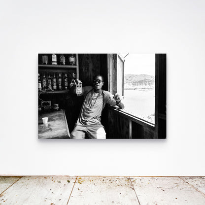 Chloe Albert's fine art print 'Dive Bar' shown unframed at 60 by 40 inches on a gallery wall above a concrete floor, displaying the large statement size in a room.