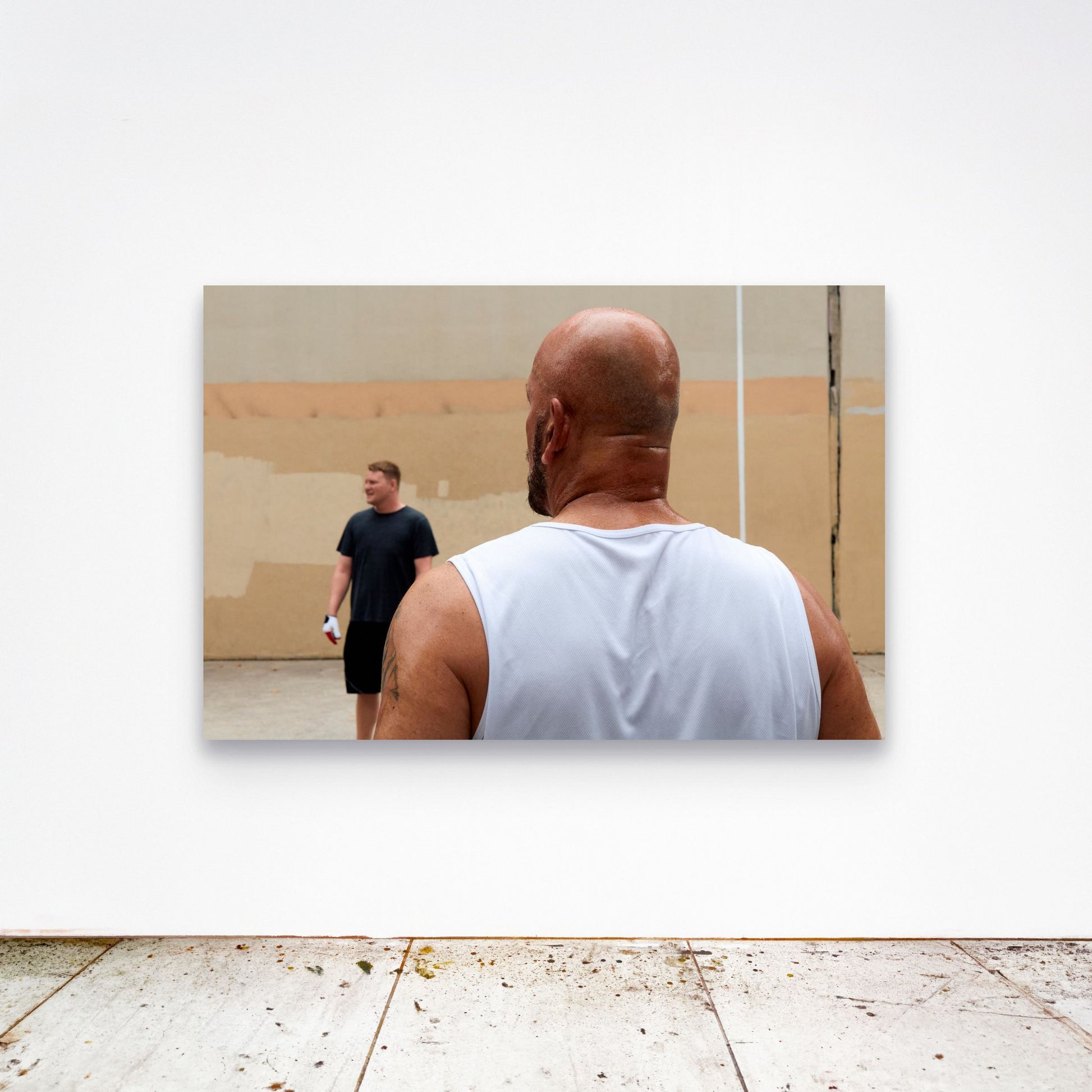 Chloe Albert's fine art print 'Exhale' shown unframed at 60 by 40 inches on a gallery wall above a concrete floor, displaying the large statement size in a room.