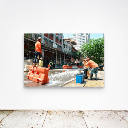 Chloe Albert's fine art print 'Fire Hydrant' shown unframed at 60 by 40 inches on a gallery wall above a concrete floor, displaying the large statement size in a room.