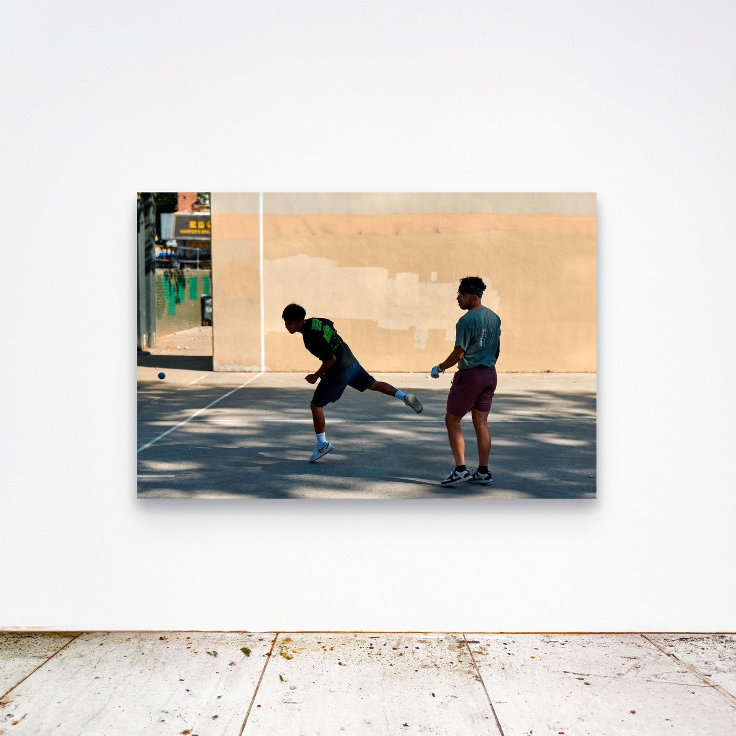 Chloe Albert's fine art print 'Flight' shown unframed at 60 by 40 inches on a gallery wall above a concrete floor, displaying the large statement size in a room.