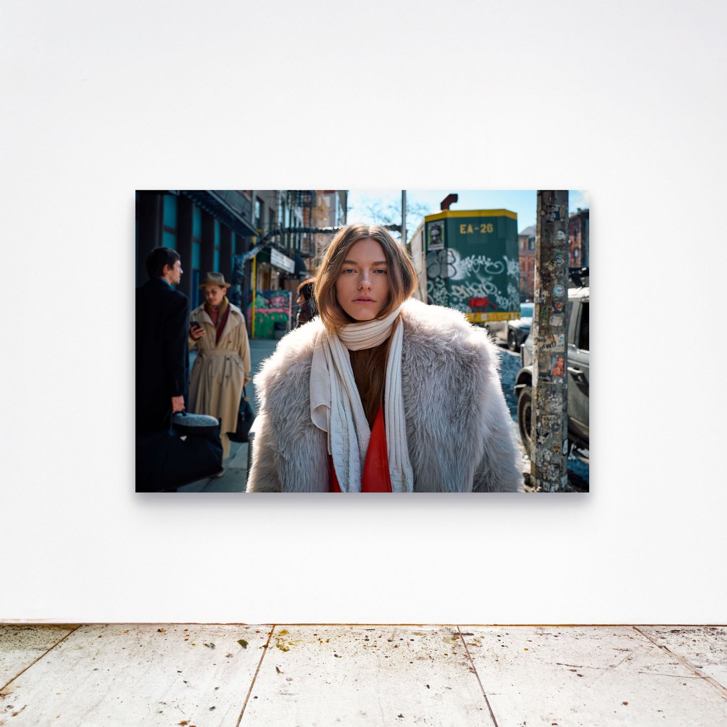 Chloe Albert's fine art print 'Fur Coat' shown unframed at 60 by 40 inches on a gallery wall above a concrete floor, displaying the large statement size in a room.