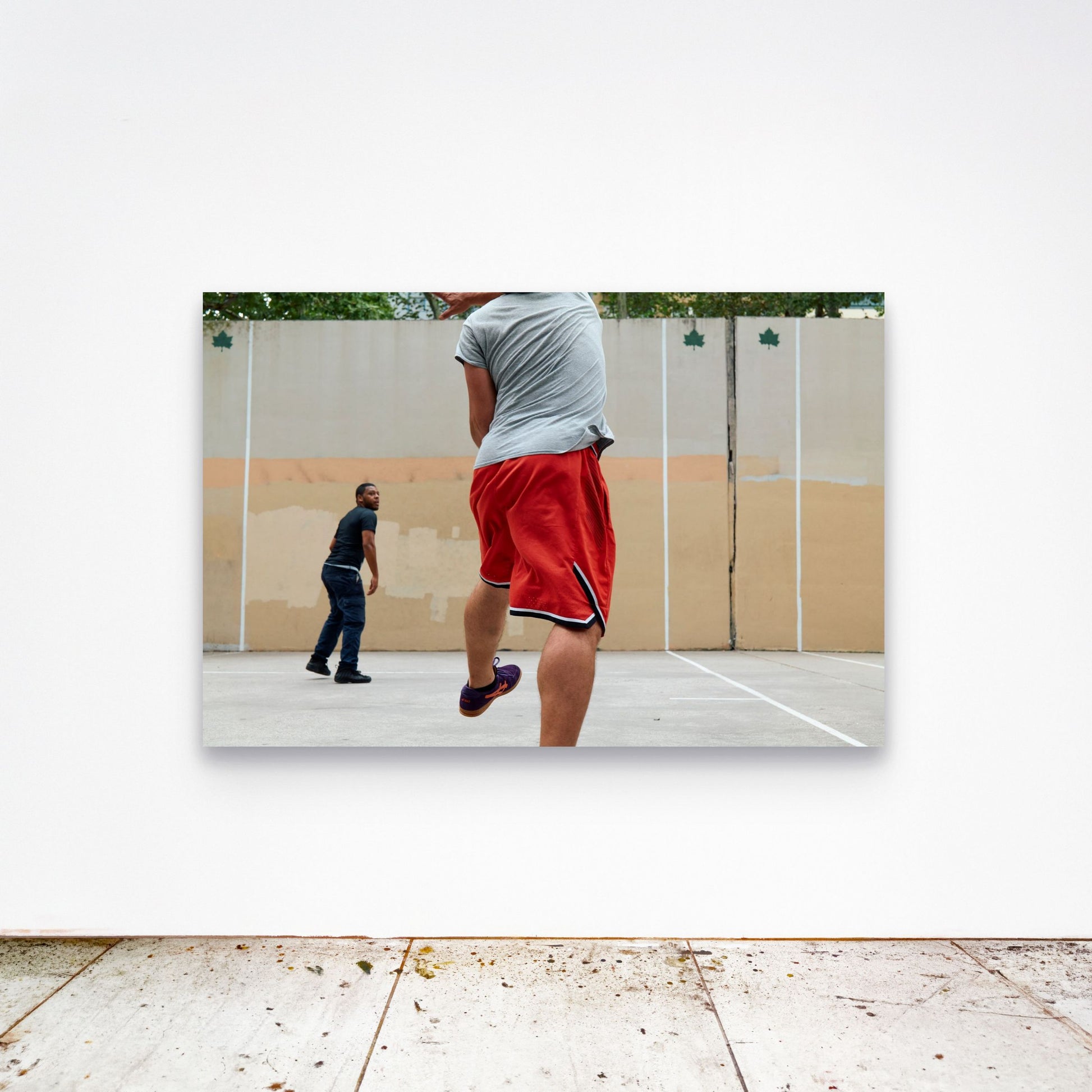 Chloe Albert's fine art print 'Holy State' shown unframed at 60 by 40 inches on a gallery wall above a concrete floor, displaying the large statement size in a room.