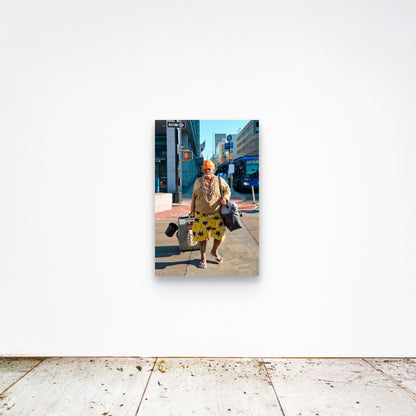 Chloe Albert's fine art print 'Man Walking' shown unframed at 36 by 24 inches on a gallery wall, displaying the print at scale in a room setting.