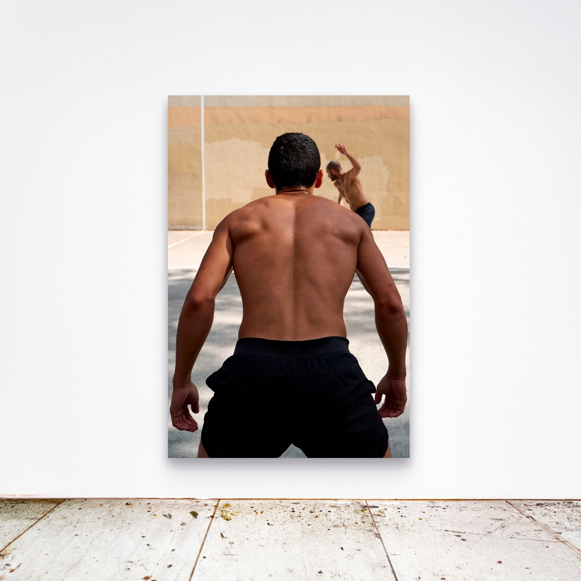 Chloe Albert's fine art print 'Monolith' shown unframed at 60 by 40 inches on a gallery wall above a concrete floor, displaying the large statement size in a room.