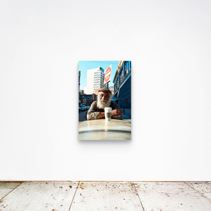 Chloe Albert's fine art print 'Morning Coffee' shown unframed at 36 by 24 inches on a gallery wall, displaying the print at scale in a room setting.