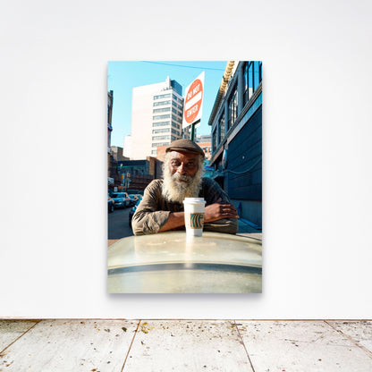 Chloe Albert's fine art print 'Morning Coffee' shown unframed at 60 by 40 inches on a gallery wall above a concrete floor, displaying the large statement size in a room.