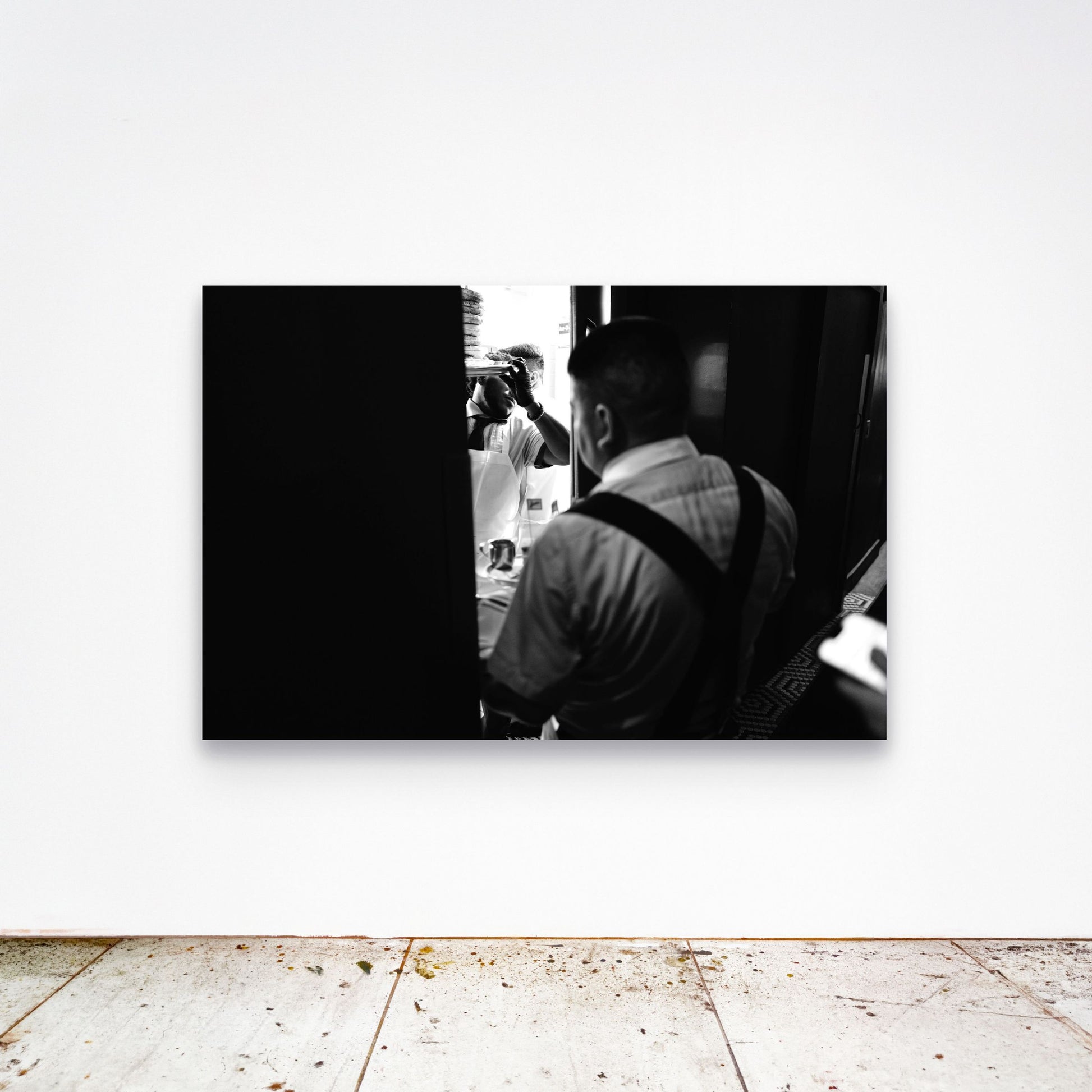 Chloe Albert's fine art print 'Sadelle's' shown unframed at 60 by 40 inches on a gallery wall above a concrete floor, displaying the large statement size in a room.