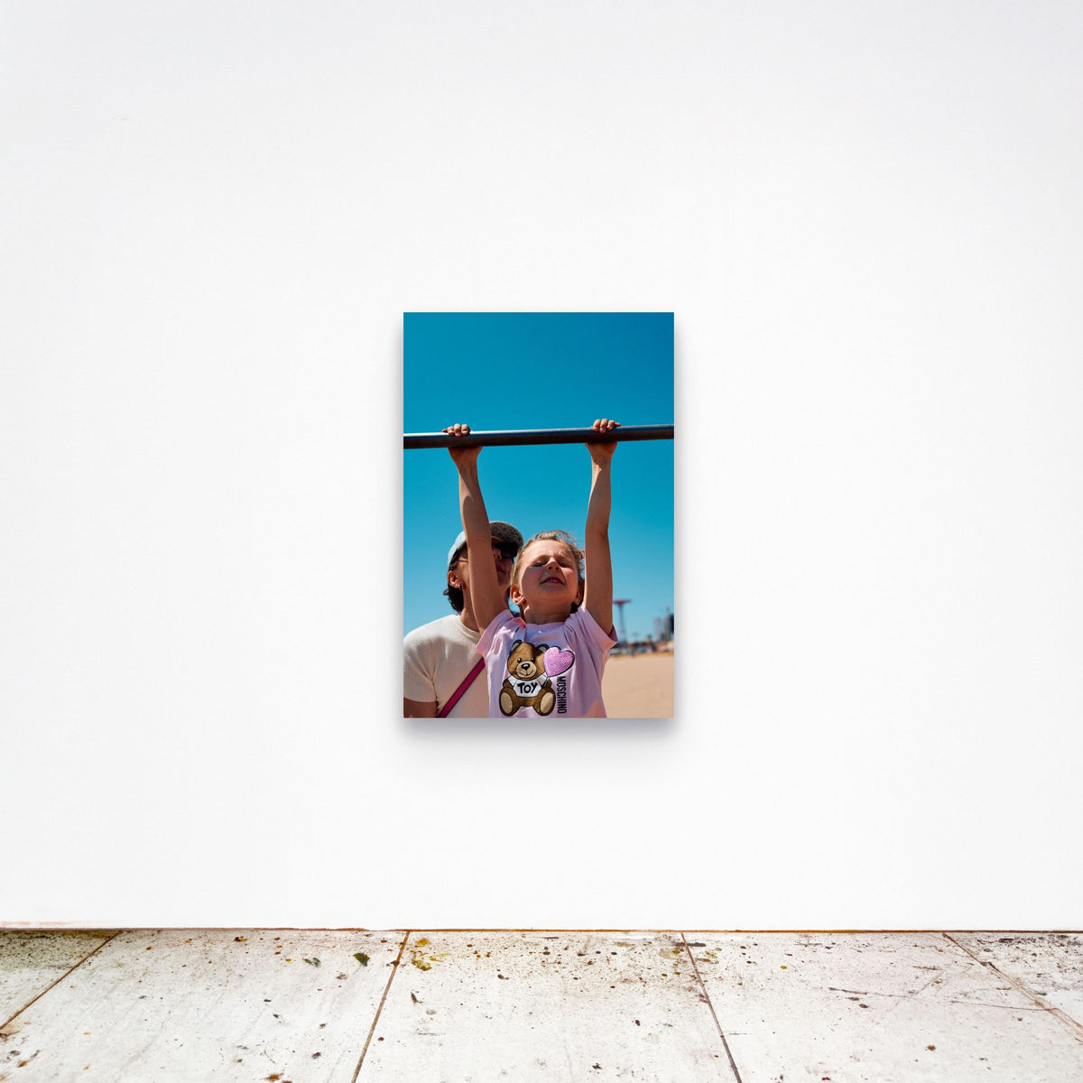 Chloe Albert's fine art print 'Suspended' shown unframed at 36 by 24 inches on a gallery wall, displaying the print at scale in a room setting.