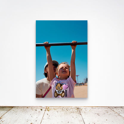 Chloe Albert's fine art print 'Suspended' shown unframed at 60 by 40 inches on a gallery wall above a concrete floor, displaying the large statement size in a room.
