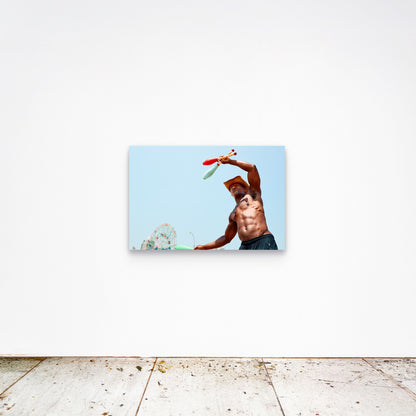 Chloe Albert's fine art print 'The Juggler' shown unframed at 36 by 24 inches on a gallery wall, displaying the print at scale in a room setting.