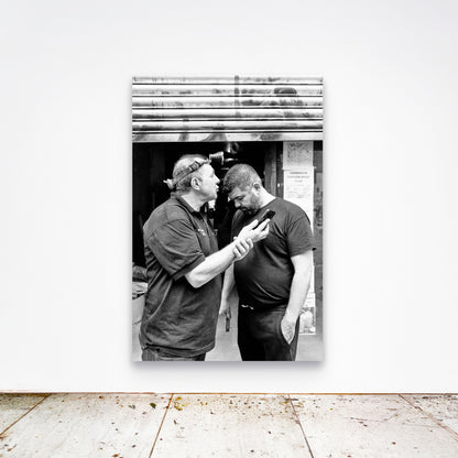 Chloe Albert's fine art print 'Workman' shown unframed at 60 by 40 inches on a gallery wall above a concrete floor, displaying the large statement size in a room.
